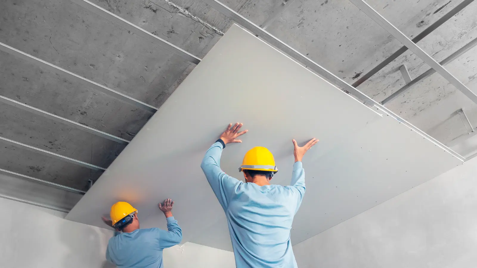 Damaged Drywall Corners . Ceiling installation with acoustic panels With professional technicians