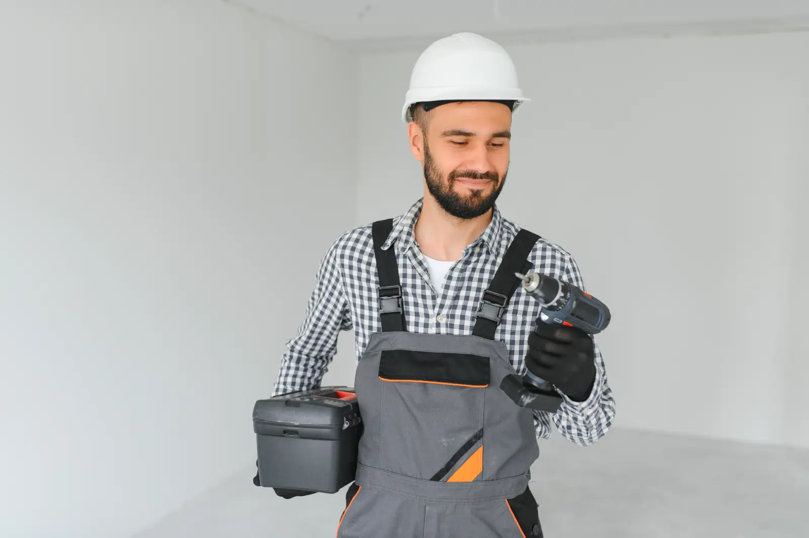 Smooth Drywall Joint Finishing. Portrait of a builder on a construction site indoors