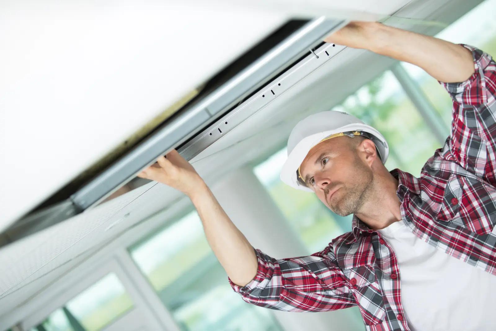 Plasterboard Wall . man in the form of construction set ceilings