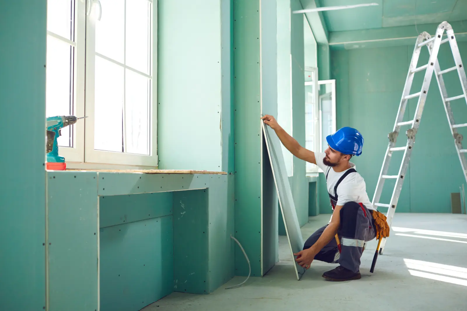 Textured Plasterboard. installs plasterboard drywall at a construction